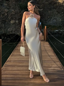 Introducing the Samantha Dress, a stunning addition to your wardrobe. Crafted from luxurious white satin, this elegant dress exudes sophistication and grace. Perfect for special occasions, it's the perfect choice for those looking to make a statement. Elevate your style with the Samantha Dress.