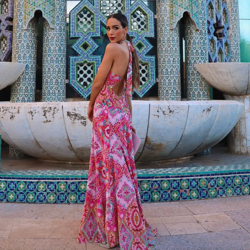 Get ready to embrace your inner bohemian goddess with our Robe Rema! This vintage tie dye halter dress features a bold floral print and intricate lace details. The off shoulder and backless design adds a touch of romance to this ethnic-inspired maxi dress. Make a statement at your next prom or event with the Robe Rema (and maybe a few twirls)!