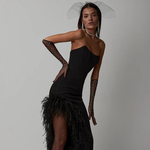 Upgrade your wardrobe with the Dress Marija. This elegant bodycon dress features a unique feathers patchwork and a sexy off-shoulder design, perfect for any special occasion. The strapless style adds a touch of sophistication to your look. Made for the confident modern woman.