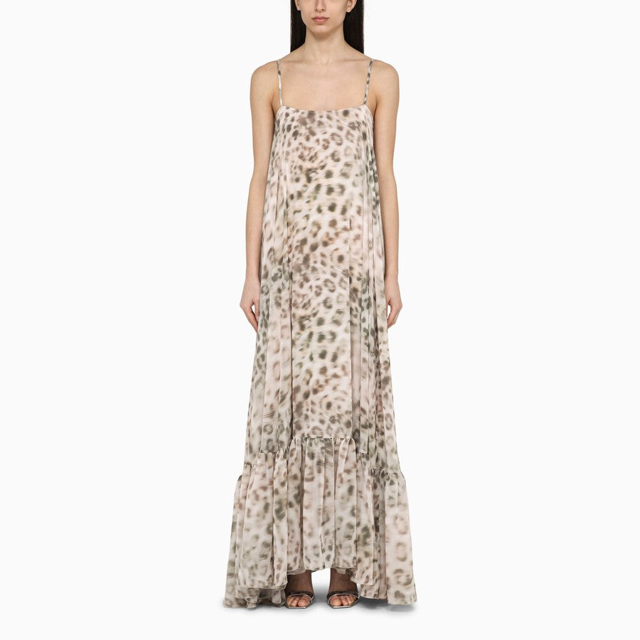 Expertly crafted from lightweight chiffon, this maxi dress features a bold leopard print that is perfect for adding a touch of wild to your wardrobe. The flowy and elegant design makes it versatile for any occasion. Stay fashion-forward with this statement piece.