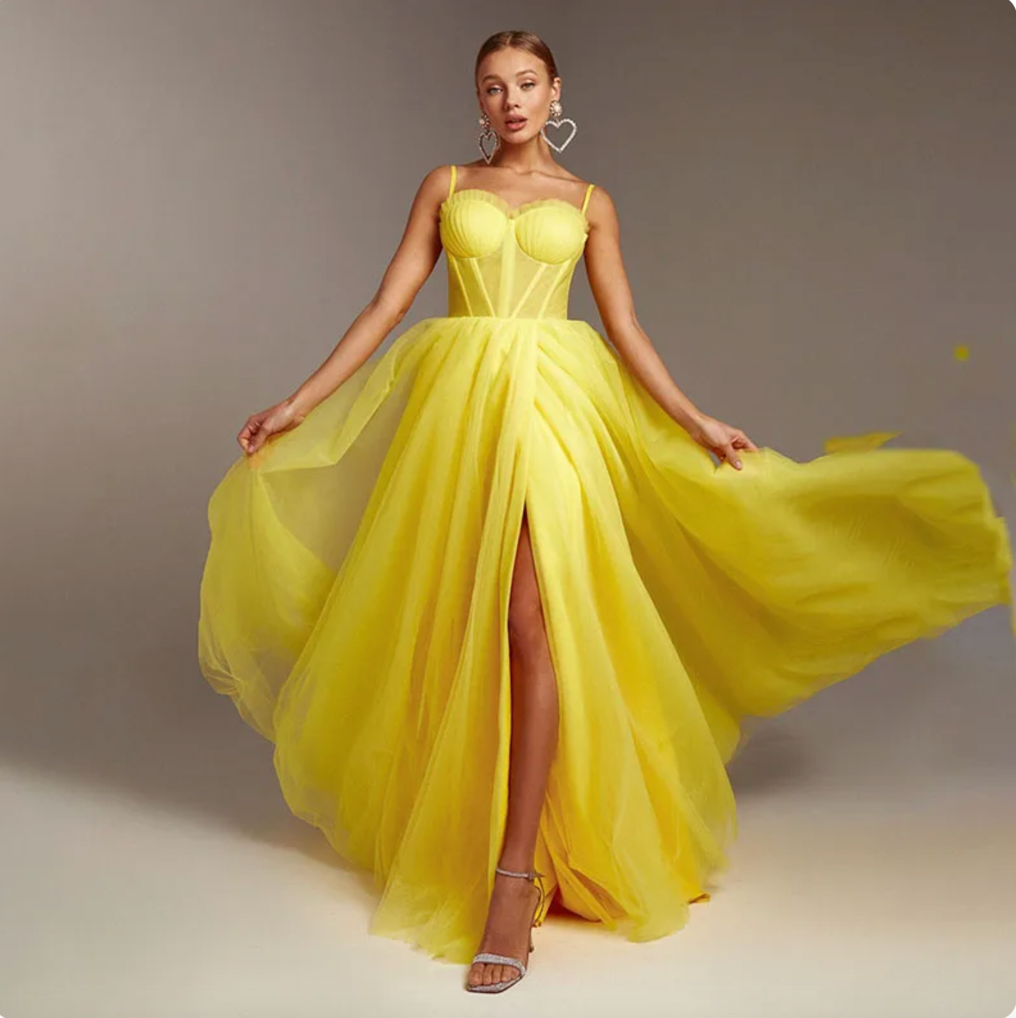 Bring a taste of sunshine to any event with the Robe Maysena dress! This bright yellow stunner features elegant spaghetti straps, sweetheart neckline and a fit that accentuates all of your best assets. Shine on your night out in perfect style!