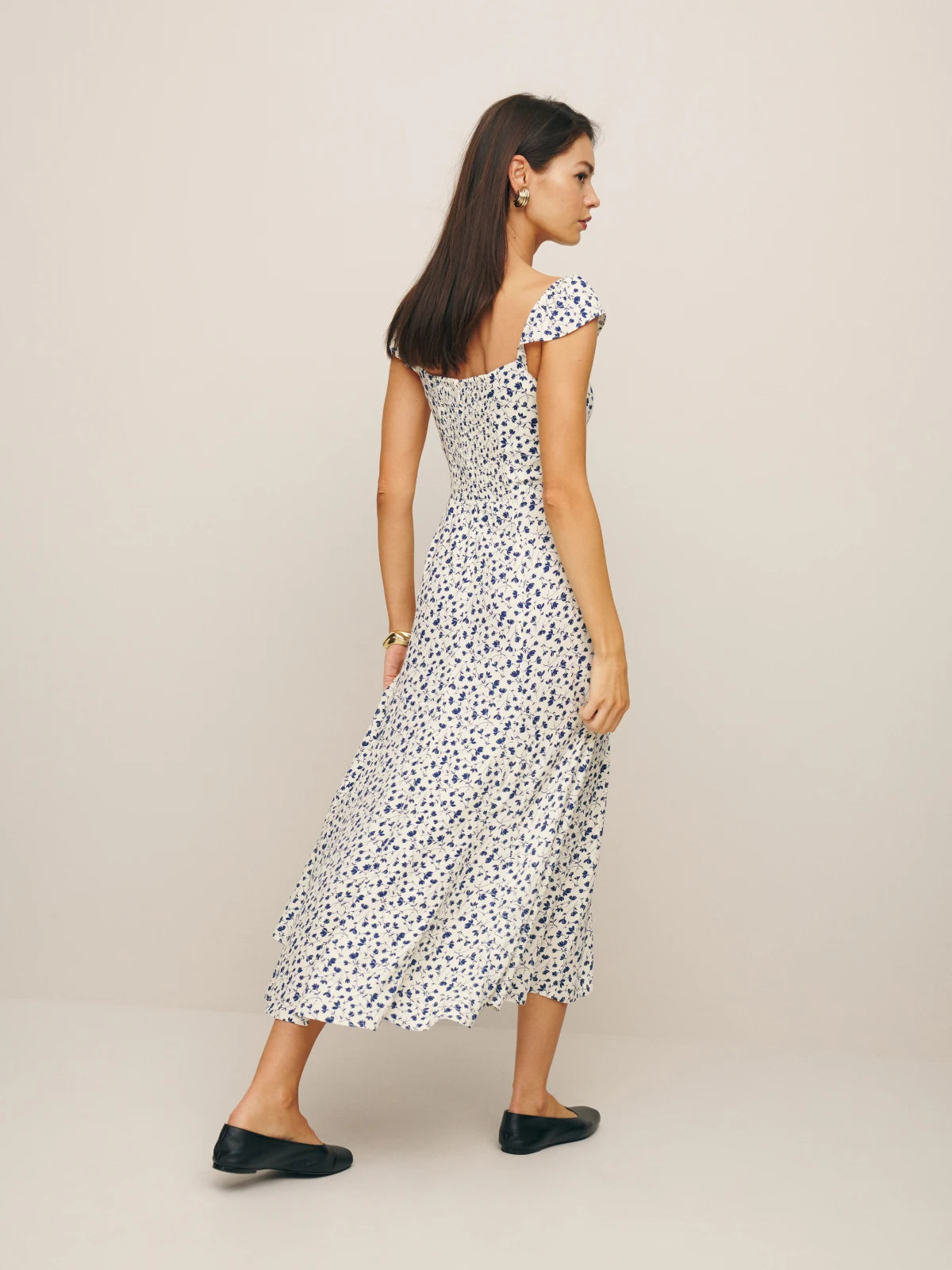 Wrap yourself in pure elegance with the Bryson Dress. Featuring a back smocking and sweetheart neckline, this dress exudes sophistication. The lightweight drapey crepe fabric with a dry hand feel adds a luxurious touch, while the back zipper and ruching details elevate the look. Perfect for any special occasion.