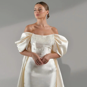 Robe Milagros is perfect for any special occasion. The exquisite off-the-shoulder sheath design features sequin fold detailing, made from luxurious satin fabric for added comfort. Look like a celebrity at your next evening or cocktail event.