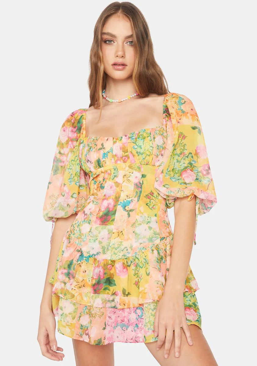 Introducing the playful and quirky Nina Mini Dress by For Love & Lemons! With its puff sleeves, square neckline, and ruched bodice, this mini dress offers a flattering and stylish silhouette. The feminine ruffle details and floral print add charm, while the convenient zip closure elevates your wardrobe. Don't miss out on this must-have piece!