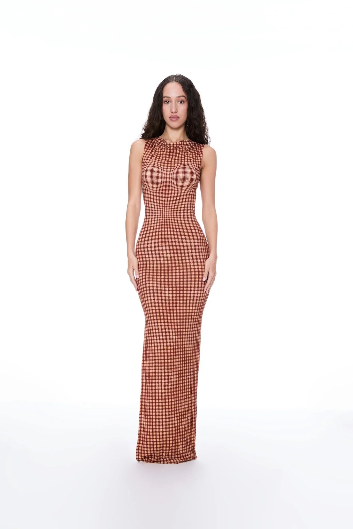 Elevate your evening with the Selena Dress. This maxi-length stunner in Warped Plaid will turn heads with its cinched waist and open back detailing. Designed for a flattering fit, it's the perfect choice for your next special occasion.