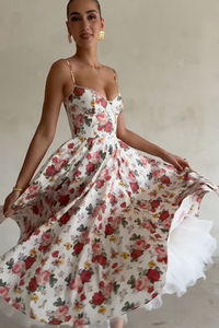 Indulge in the enchanting beauty of the Italian Rose Midi Dress. With a boned bodice, sweetheart neckline, and delicate adjustable straps, this dress cinches your waist and flatters your figure. The floaty midi skirt, featuring a voluminous layer of soft tulle, exudes an elegant and ethereal charm.