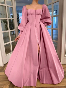 Evoke fairy tale fantasies in our Robe Eloise. The rose pink taffeta gown creates a flattering A-line silhouette with a structured bodice and lace-up back, while the gathered skirt and train exude elegance and sophistication. Complete the enchanting look with our specially designed embroidered ruffle heart gloves. Perfect for balls, weddings, and grand occasions.