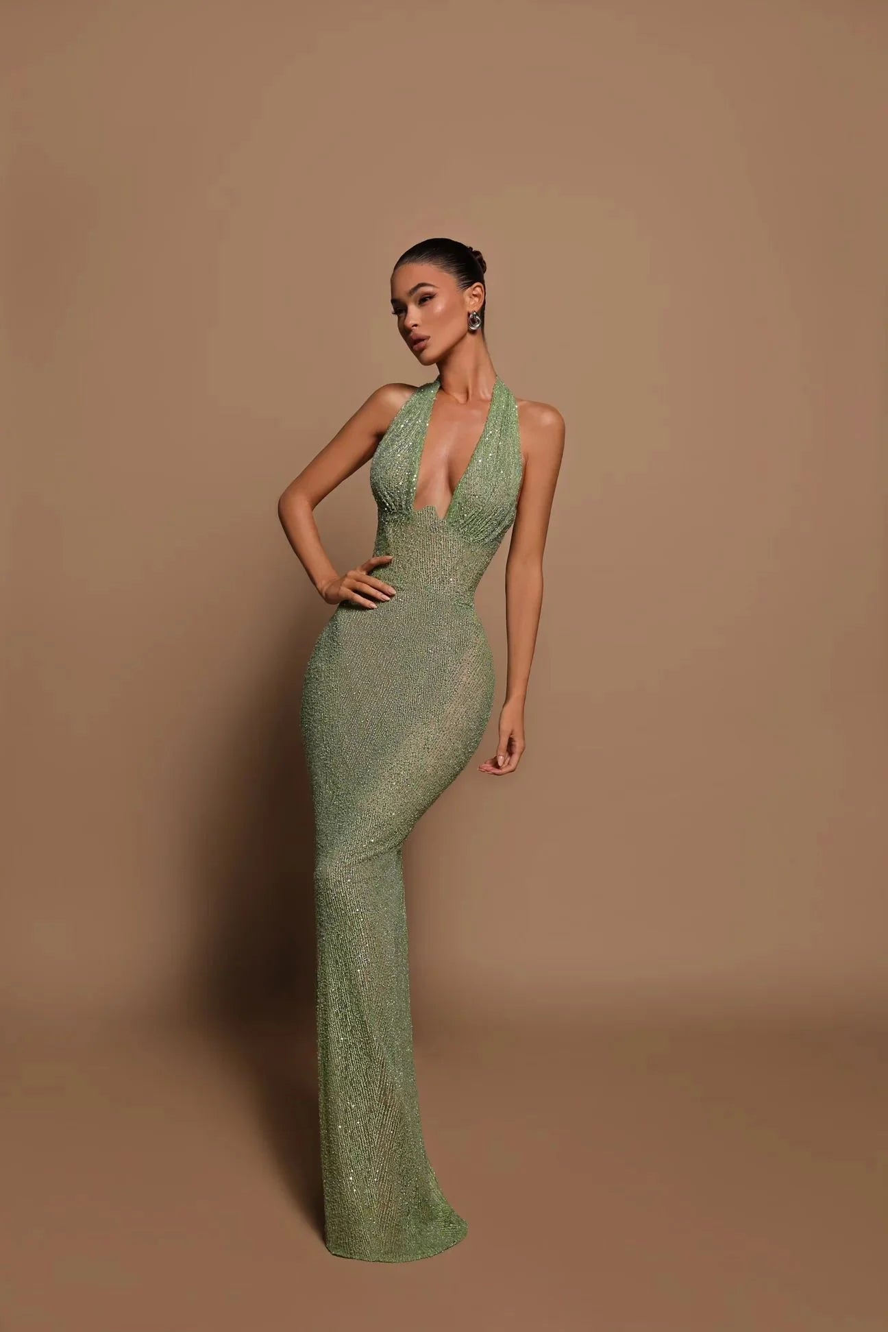 Introducing the Zinnia Sparkling Gown, a true showstopper. Embellished with delicate beads, this gown exudes luxury and sophistication. The halter neck adds a touch of elegance, while the sheer lining creates a sense of allure. Perfect for formal events or special occasions, feel like a true queen in the Zinnia Gown.