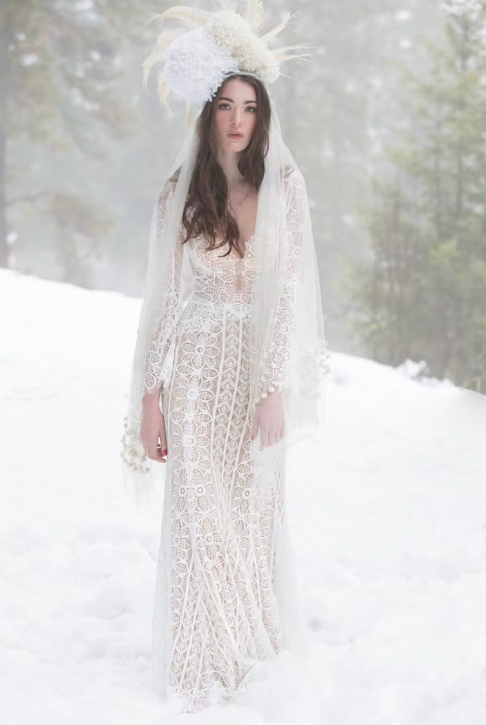 The Robe Isabelle is a stunning white lace wedding gown, perfect for the boho bride or snow princess. With intricate embroidery, this dress exudes elegance and charm. Let your inner beauty shine on your special day with this breathtaking gown.