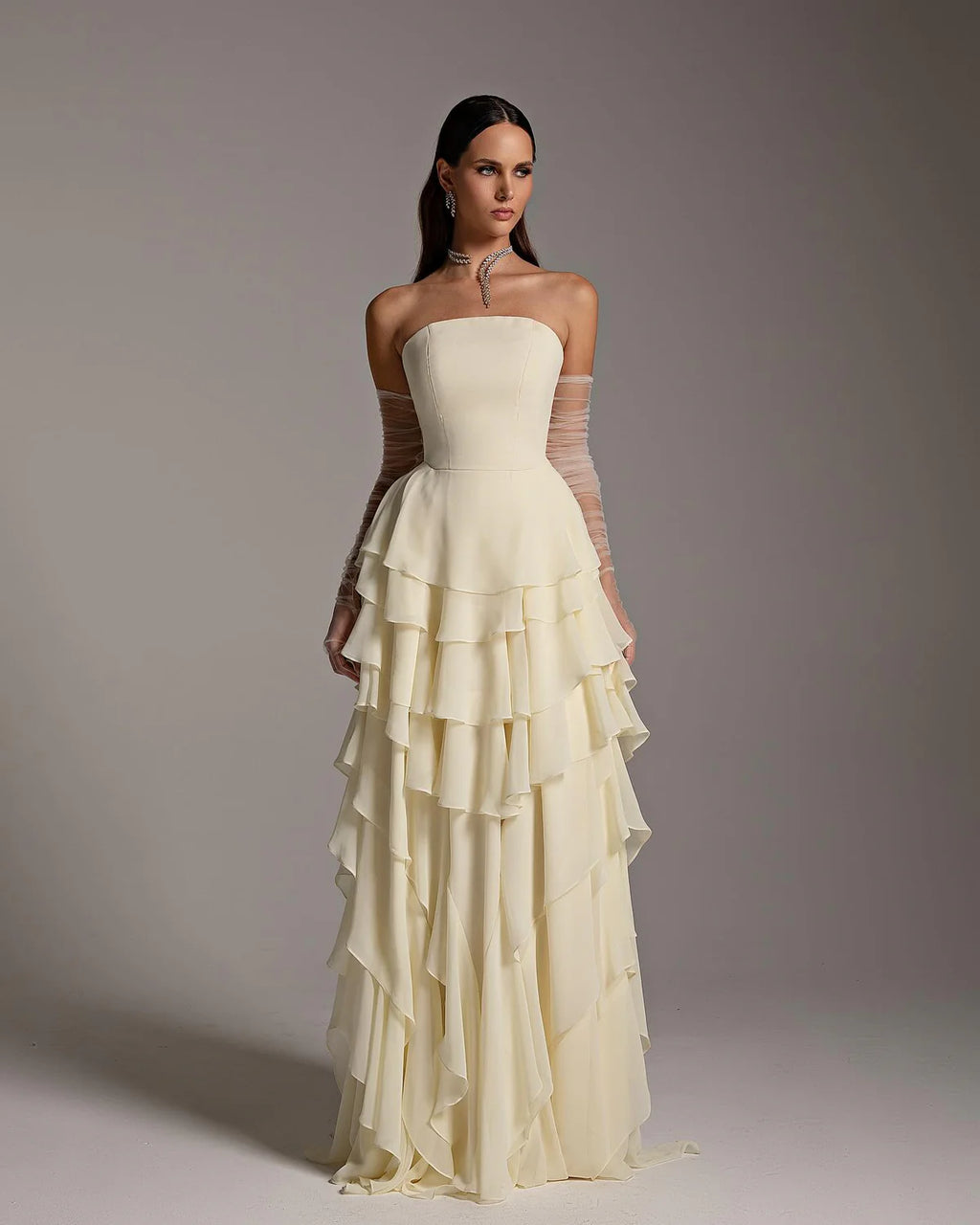 The Alexandra Gown is an elegant and sophisticated evening dress, perfect for formal occasions and weddings. Its flattering mermaid silhouette, flowing cut, and long sleeves create a sophisticated look. The unique criss-cross design adds a modern twist to this traditional Arabic design. Make a statement with this stunning piece!