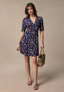 Get ready to turn heads in the Gabinette Mini Dress. This short V-neck wrap dress in bucolic blue features a five button fastening and tie on the front. Its flattering cut and waist cinching design will enhance your figure and neckline. Gabinette's playful twist will make you stand out in the best way!