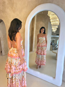 Get ready to turn heads in the Laurel Frill Maxi Dress! Perfect for weddings, baby showers, and garden events, this dress is both feminine and fun. You'll love the straight neckline with scallop cut detail, tiered frill skirt, and open back. Plus, the lace up corset allows for a comfortable fit on any body shape.