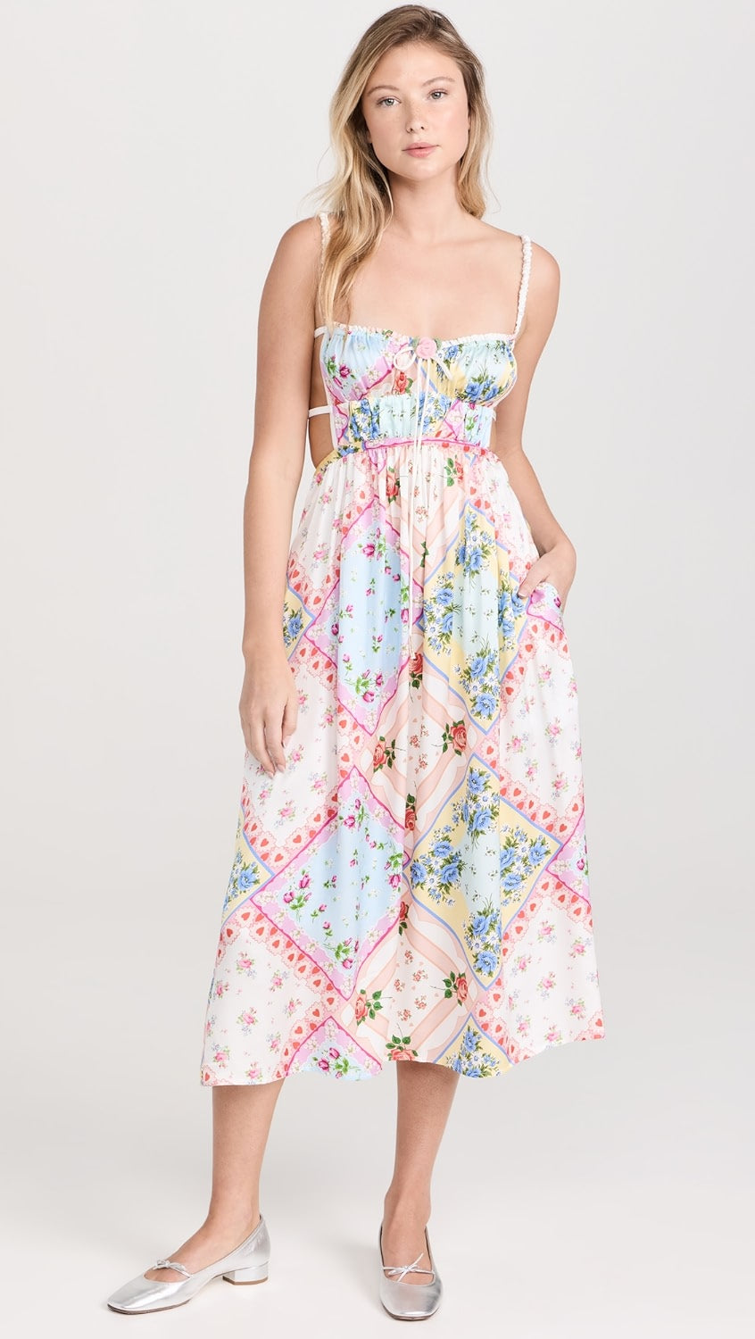 Get ready to turn heads in the Cassandra Floral Dress by For Love & Lemons! Made from lightweight, non-stretch satin, this dress features a stunning floral patchwork print and a crochet rose applique with a bow at the bust. The playful open back with ties and sweetheart neckline add a touch of fun to this dress. It also has ruched elastic shoulder straps, a covered elastic waistband, and convenient on-seam hip pockets.