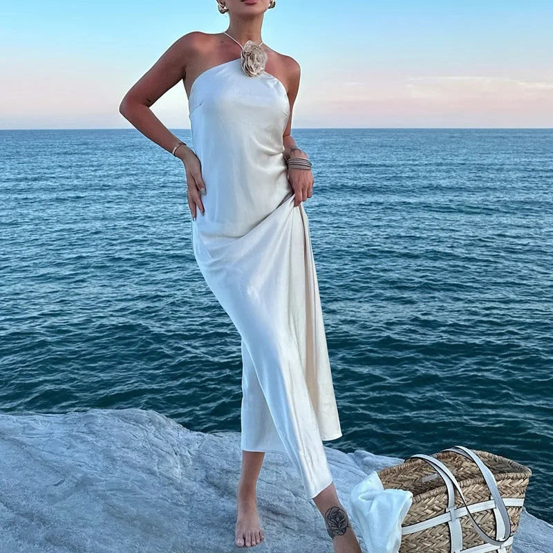 Introducing the Samantha Dress, a stunning addition to your wardrobe. Crafted from luxurious white satin, this elegant dress exudes sophistication and grace. Perfect for special occasions, it's the perfect choice for those looking to make a statement. Elevate your style with the Samantha Dress.