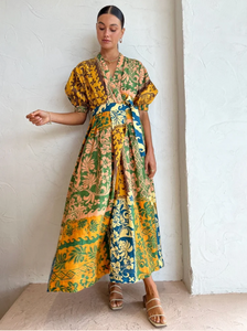 A tropical delight, ALÈMAIS welcomes the Archie Wrap Dress in Multi.   Crafted from a linen fabrication, this relaxed wrap dress silhouette features tuck details at the waist, elasticated cuff and self tie.   Falling to a flared skirt, it is the perfect companion for long lunches, beach days and weekend wanderings.