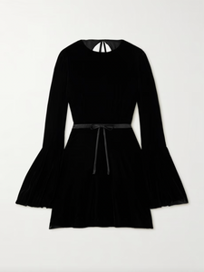 Indulge in opulence with SAINT LAURENT's velour mini dress. The retro-inspired bell sleeves and flared skirt exude a skater vibe, while the open back adds a touch of sensuality. Made in Italy, the plush velour is elevated by a satin belt that cinches your waist. Complete the look with stilettos and a mini bag.