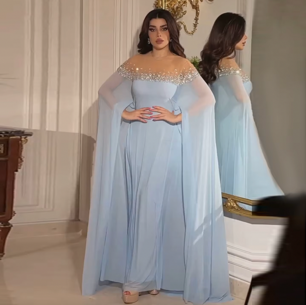 Elevate your style with the Sarah Gown. This exquisite Luxury Crystal Baby Blue Evening Dress is adorned with intricate crystal detailing, ensuring a truly luxurious experience. Perfect for weddings and special occasions, the kaftan style offers a comfortable and flattering fit, making you the center of attention. Order now and be the belle of the ball.