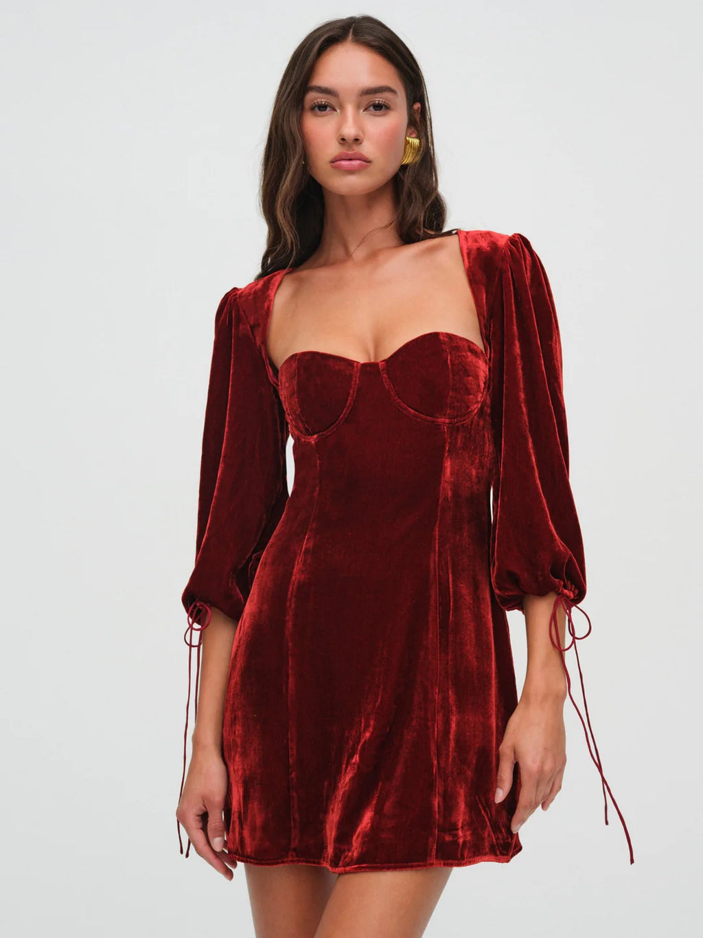 Elevate your date night look with the Nadine Mini Dress. The luxurious velvet and corset design exude elegance and romance. Three-quarter length blouson sleeves and underwire cups create a flattering silhouette, while the sweetheart neckline adds a touch of sensuality. Make a statement in this exclusive and sophisticated piece.