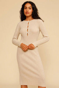 Experience effortless chic this autumn and winter with our Elona Midi Dress. Made from high-quality rib knit fabric, this vintage cutout dress features a figure-hugging silhouette, cascading cut-outs with bows, and a crew neckline. Perfect for work from home or dressing up on off-duty days. Complete the look with mid-calf heeled boots and a snakeskin baguette bag.