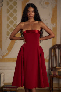 Indulge in luxury with the Scarlet Charmeuse Dress. This strapless, lady length dress boasts a fold over collar in silk charmeuse and a built-in inner bodice with silicone gripper elastic. Equipped with godets at the high hip and invisible zipper, it offers both style and convenience. Feel chic and confident with this elegant dress.