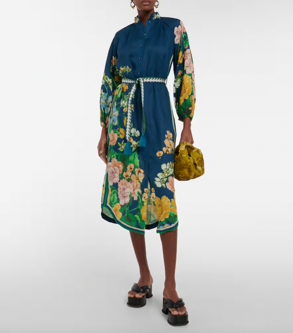 Unleash your playful side in the Lyla Floral Shirtdress by Alemais! This breezy, buttoned shirtdress features a relaxed silhouette, stand-collar, and balloon sleeves for a bold yet effortless look. Plus, the tassel-embellished woven jacquard belt adds the perfect touch of quirky charm. Dress up or down for any occasion.