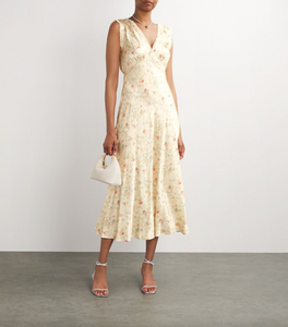 Embrace your adventurous side with the Silk Floral Tahlia Midi Dress. This versatile design can be dressed up with heels for a night out or dressed down for a casual sunset stroll through an orchard. With its bold floral pattern and flowing silhouette, it's perfect for any risk-taker looking to make a statement.