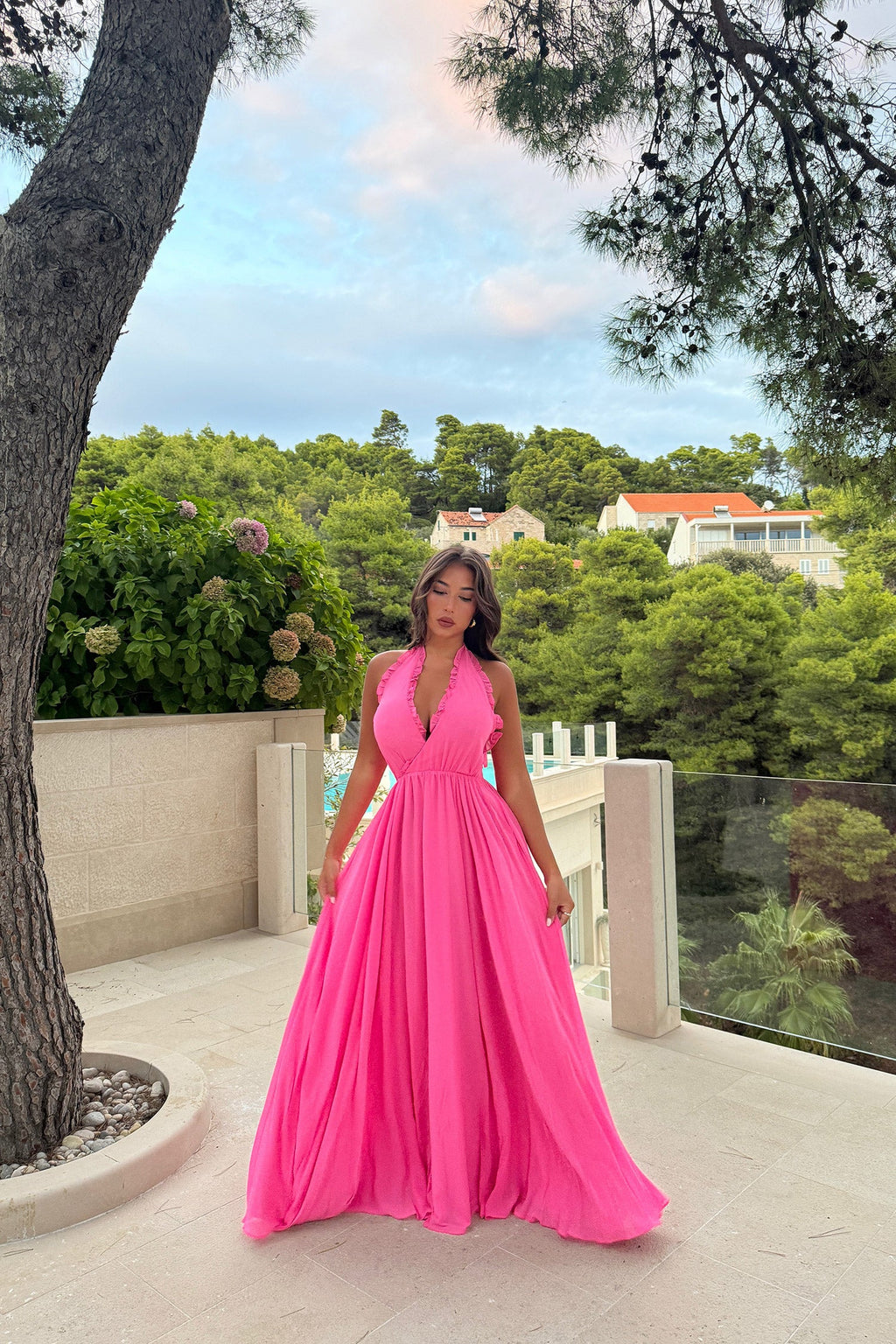 Elevate your style with the Susanna Dress. Its cross V-neckline and pleated edges add unique sophistication, while the bright pink georgette chiffon fabric and satin lining exude luxury. Perfect for weddings, parties, and summer outings, this flowing dress will make you feel like a true fashionista.