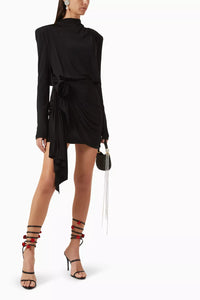 Chic and refined, Magda Butrym’s mini dress seamlessly slots into cocktail dress codes. It’s crafted with a touch of stretch and creates a commanding silhouette with removable shoulder pads. For the minimalist at heart, sleekly styled hair and a touch of jewellery are all you’ll need to complete the look.