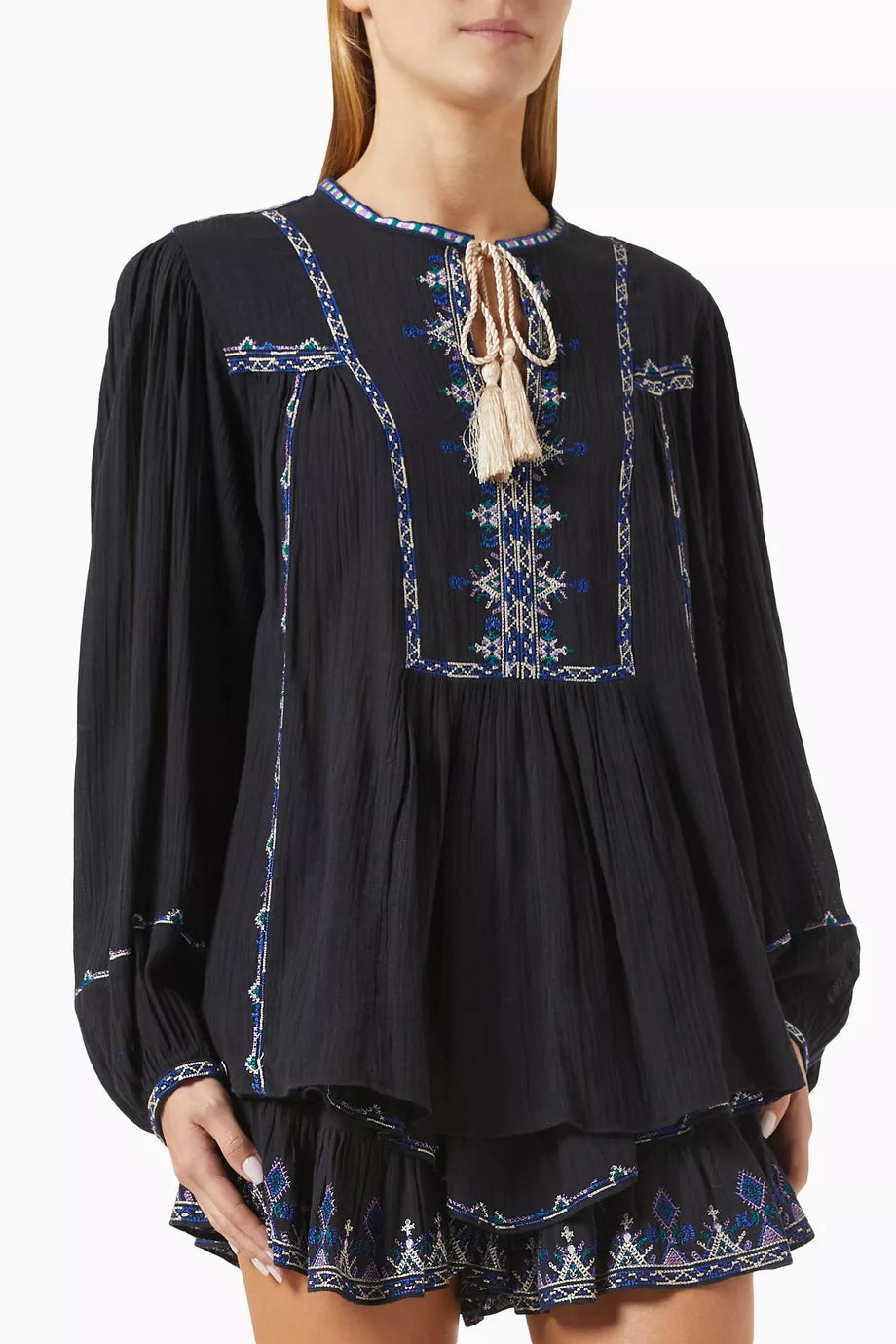 Embrace elegance with the Isabel Marant Etoile Silekia Embroidered Top. Crafted in soft cotton, this top features a stylish neck tie-up and intricate embroidery, adding a sophisticated touch to any outfit. Perfect for any occasion, it's a must-have piece for your wardrobe.