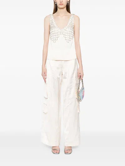 Indulge in luxury with the SELF-PORTRAIT Satin Diamond Bralette Top. Exquisitely crafted from high-quality satin, this elegant top features a unique diamond-shaped bralette design and comes in a beautiful beige color. Elevate any outfit with this tasteful and exclusive piece from the renowned brand SELF-PORTRAIT.