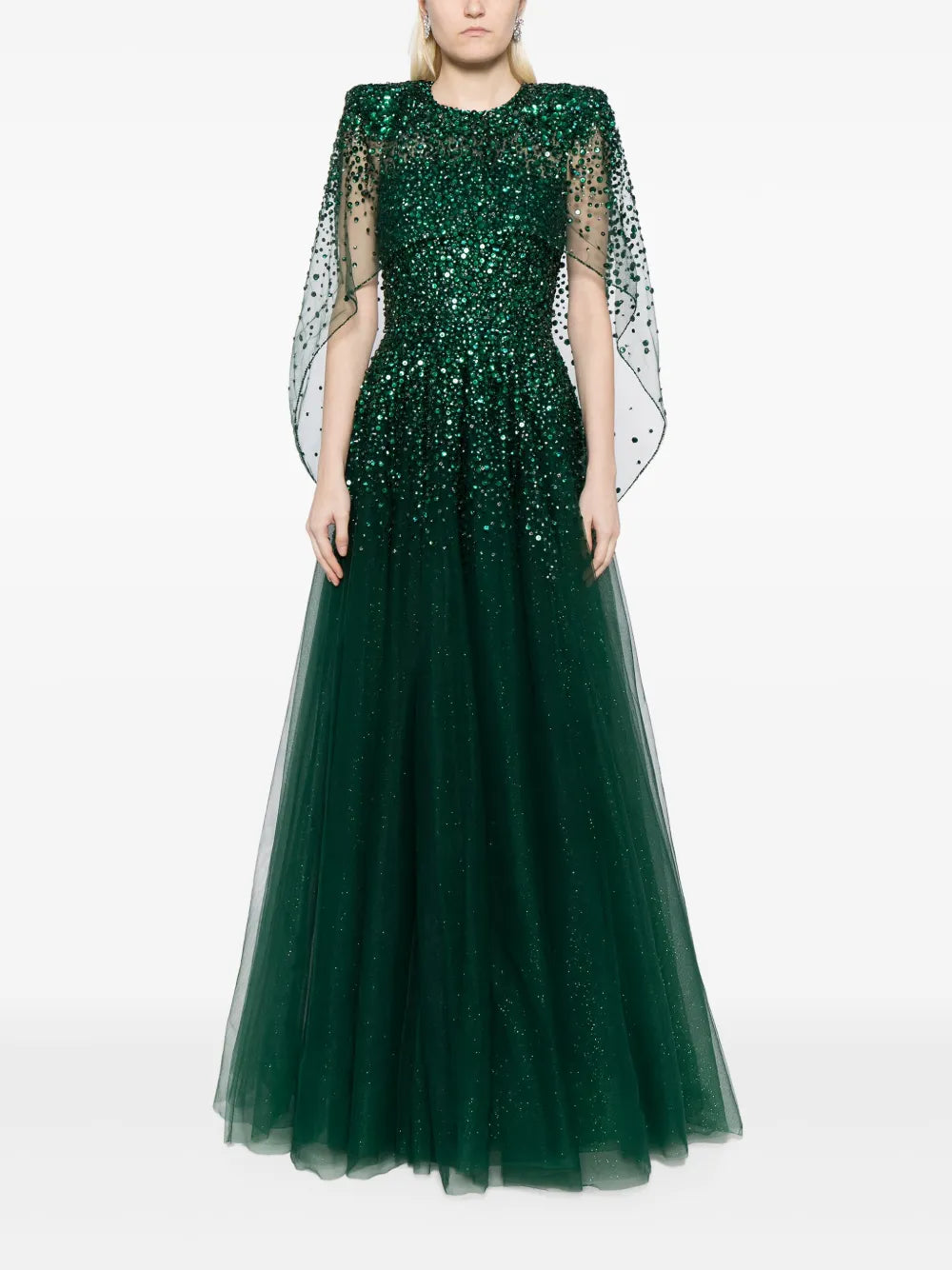 Indulge in elegance with Jenny Packham's Osha sequin-embellished cape gown. This forest green dress features a sparkling sequin bodice and sheer overlay, while the cape design and full silhouette add a touch of drama. With a round neck, fitted waistline, and floor-length full skirt, this gown is perfect for any formal event.