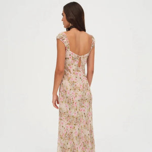 Love is in bloom with this ultra-romantic Emmaline floral maxi dress—a chiffon light yellow dress decorated in a dream-like floral print. Featuring ruched cups with an alluring ribbon lace trim at the sweetheart neckline—it's the perfect wedding guest dress to celebrate love.