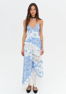 Introducing the luxurious Rosalyn Dress from For Love and Lemons, back in a stunning blue floral print. Inspired by '70s fashion, this maxi dress features mixed print paneling and delicate floral lace with elegant ruffle details. The plunging neckline and skinny shoulder ties add a touch of sophistication. Perfectly fitted through the bust, this dress then cascades into an A-line silhouette, creating a flattering and effortless look. 