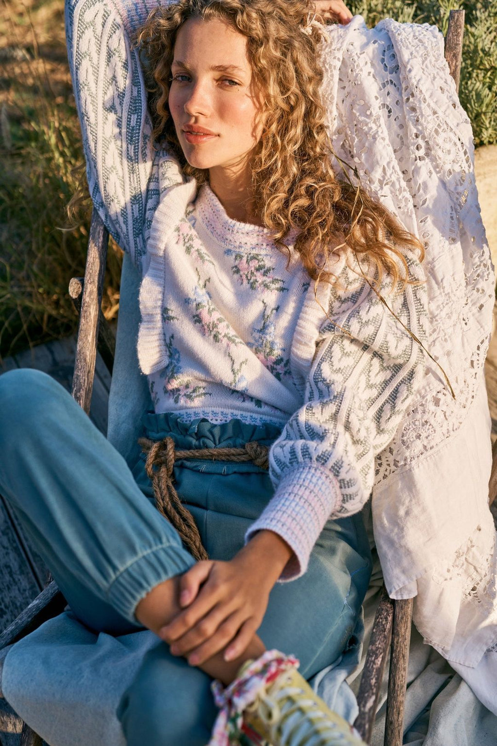 Elevate your style with Warwick in Dew Drop Cream. The romantic floral knit intarsia and framing knit heart jacquard blouson sleeves add a touch of elegance to this cropped crewneck sweater. The striped rib knit neck, cuffs and hem offer a flattering fit and extra detail. Embrace your feminine side with this must-have sweater.