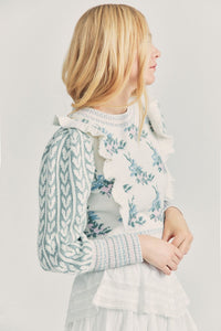 Elevate your style with Warwick in Dew Drop Cream. The romantic floral knit intarsia and framing knit heart jacquard blouson sleeves add a touch of elegance to this cropped crewneck sweater. The striped rib knit neck, cuffs and hem offer a flattering fit and extra detail. Embrace your feminine side with this must-have sweater.