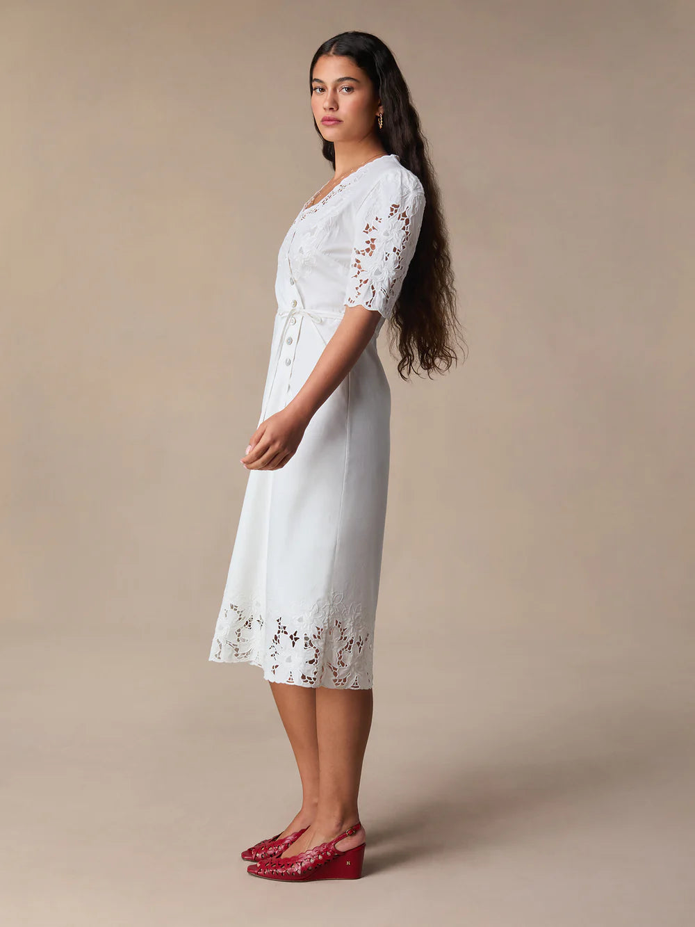 This stunning Audrey Midi Dress is perfect for any occasion. The elegant white embroidery adds a touch of sophistication, while the mid-length and wrap design create a flattering and versatile silhouette. Dress it up or down, this dress is sure to make you feel confident and chic!