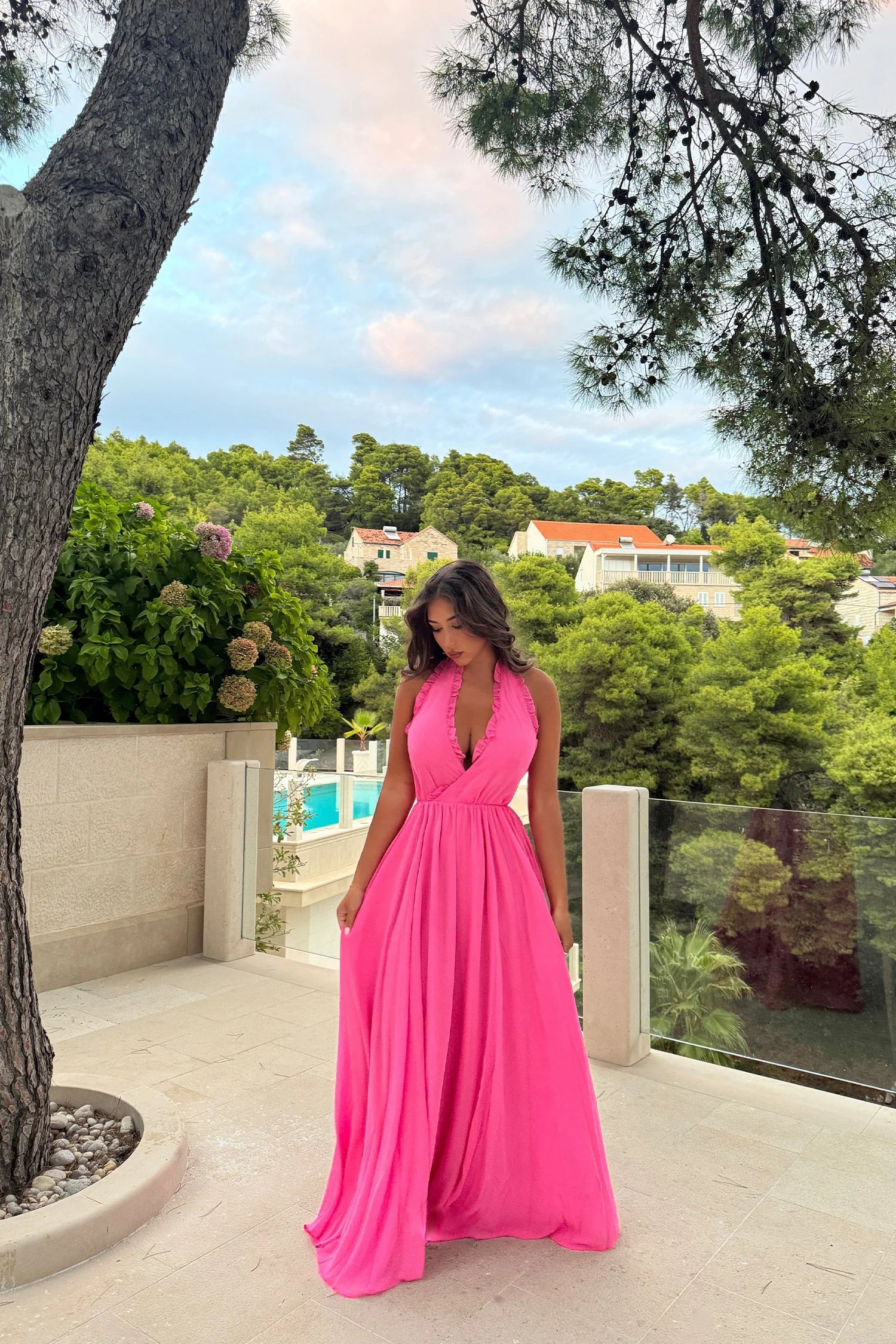 Elevate your style with the Susanna Dress. Its cross V-neckline and pleated edges add unique sophistication, while the bright pink georgette chiffon fabric and satin lining exude luxury. Perfect for weddings, parties, and summer outings, this flowing dress will make you feel like a true fashionista.