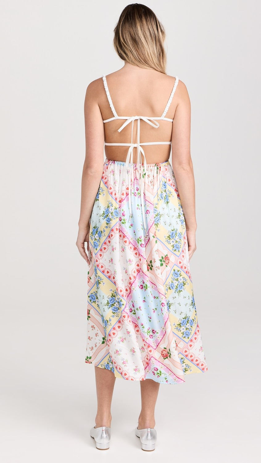 Get ready to turn heads in the Cassandra Floral Dress by For Love & Lemons! Made from lightweight, non-stretch satin, this dress features a stunning floral patchwork print and a crochet rose applique with a bow at the bust. The playful open back with ties and sweetheart neckline add a touch of fun to this dress. It also has ruched elastic shoulder straps, a covered elastic waistband, and convenient on-seam hip pockets.