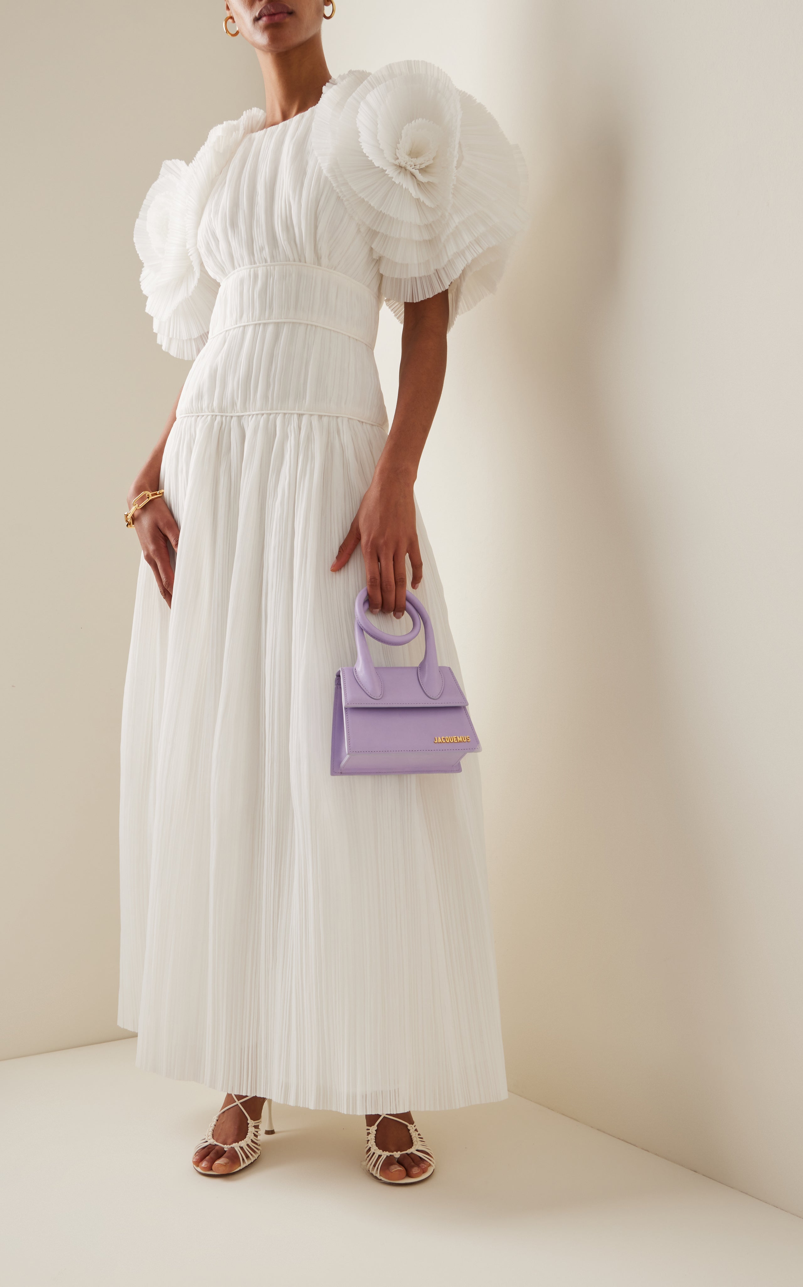 Indulge in effortless elegance with the Ruffle-Detailed Maxi Dress by AJE. The signature silhouette is elevated with sculptural statement ruffles, echoing the wave-like fields of Maya Lin. Complete the look with simple strappy pumps for a truly 'Expressive' style.