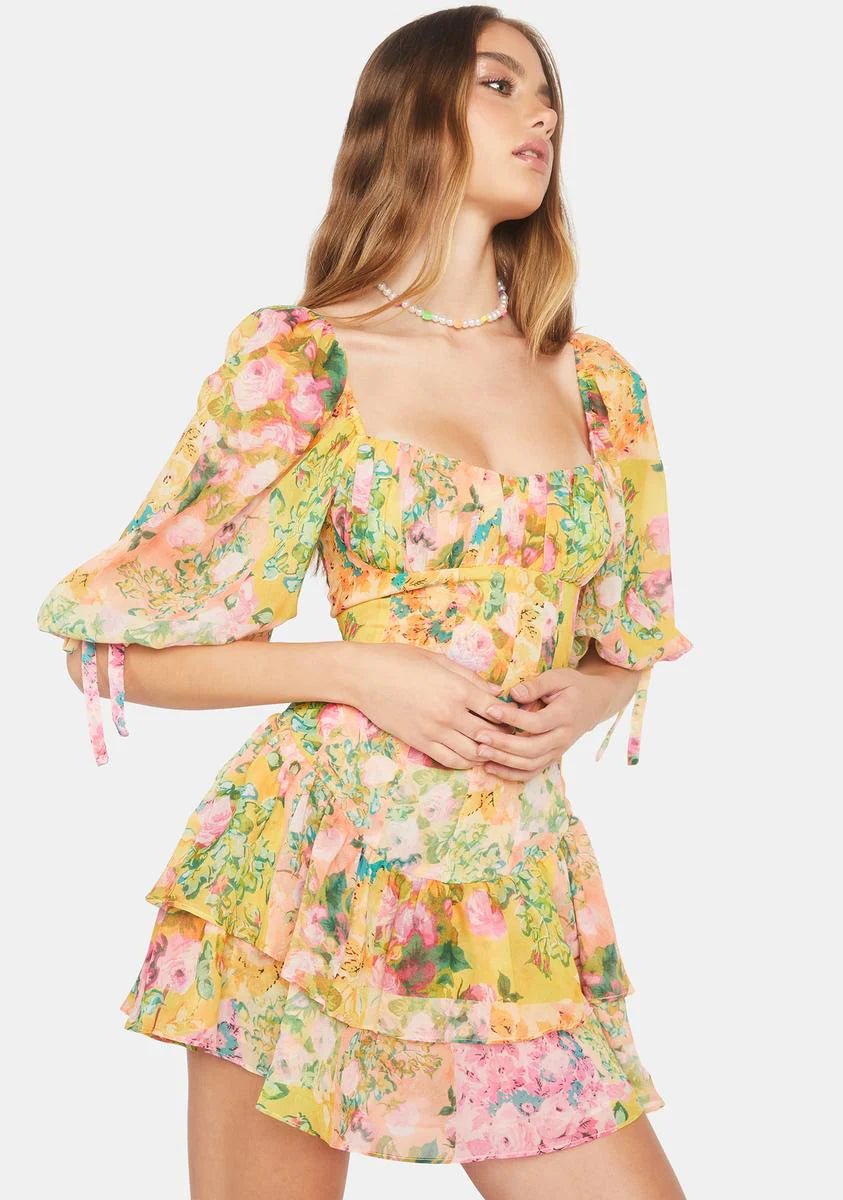 Introducing the playful and quirky Nina Mini Dress by For Love & Lemons! With its puff sleeves, square neckline, and ruched bodice, this mini dress offers a flattering and stylish silhouette. The feminine ruffle details and floral print add charm, while the convenient zip closure elevates your wardrobe. Don't miss out on this must-have piece!