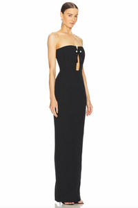 The Imani Gown features a hidden back zipper closure, boned bodice with neckline cut-out and tassel accent, and a crepe fabric with back vent. With its elegant design and functional details, this gown provides a seamless and comfortable fit for any formal occasion. Effortlessly make a statement and turn heads with this sophisticated and stylish piece.