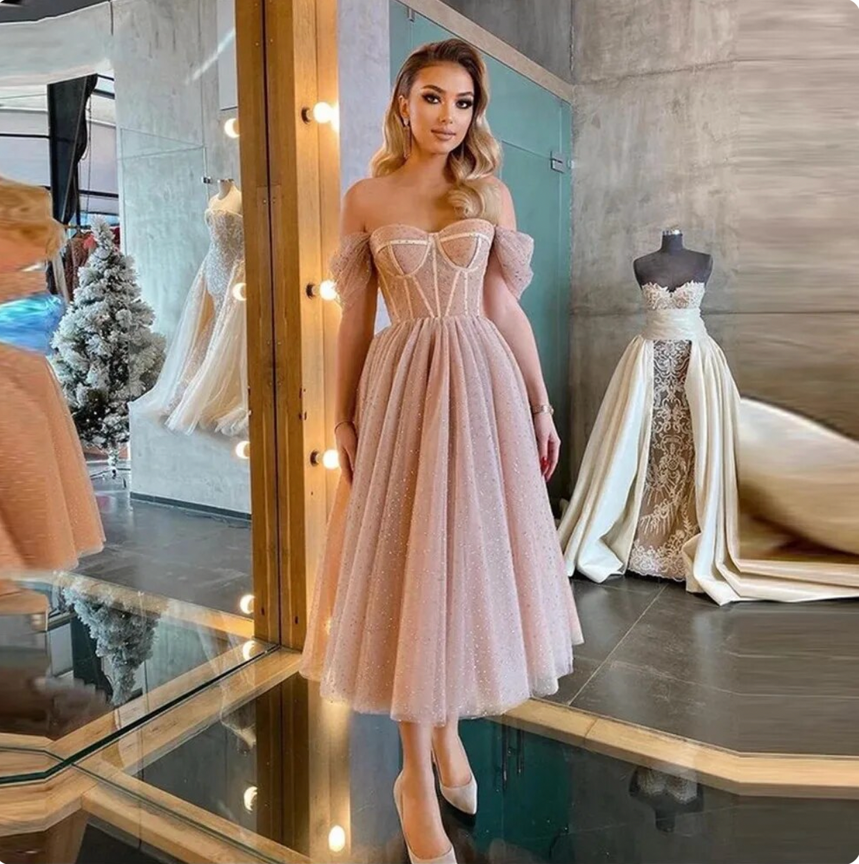 Expertly crafted with lustrous satin and delicate spaghetti straps, the Dress Loretta is the epitome of understated elegance. Its custom-made design features a chic V-neckline, alluring backless silhouette, and a sweeping train with a daring high slit. Make a statement on your special day with this simple yet stunning wedding dress.