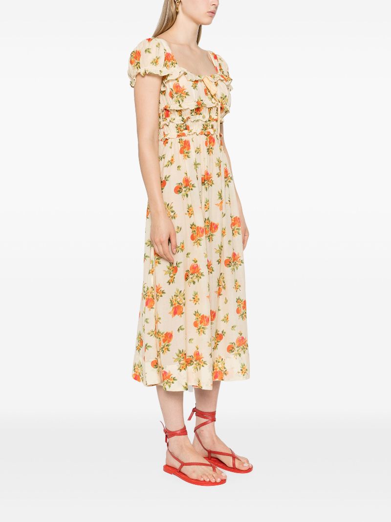 The Clarinet Floral-Print Midi Dress by Doen features a pale yellow floral print, a square neck, and short puff sleeves with elasticated cuffs. The smocked waist and bow detail at the front create a flattering silhouette. Perfect for adding a touch of spring to your wardrobe.