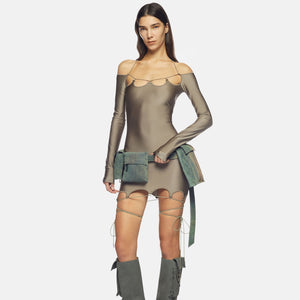 The "Lyna" military-inspired mini dress showcases a scalloped neckline and hem in glossy lycra, while also including signature cylindrical logo metal accents. With a sleek and refined appearance, this dress is suitable for any event and is guaranteed to make a bold impression, courtesy of The Attico.