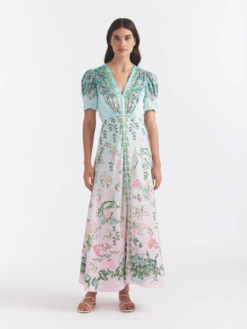 The Lea Maxi Dress, cut in a stamped satin, features a colour block placement with linear waves and paisley floral vines. Its bias cut flatters the figure and allows for fluid, easy movement. A must-have in any woman's wardrobe.