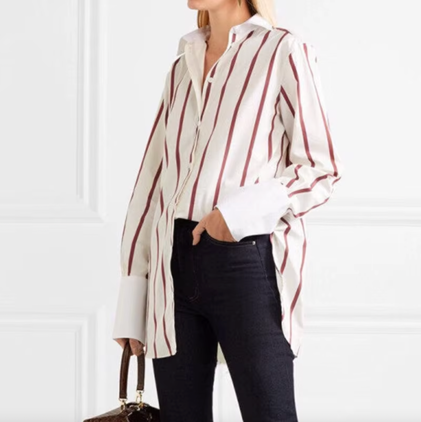 The Sassa Oversized Striped Cotton-poplin from Toteme is a must-have for any fashion-forward individual. Its luxurious cotton-poplin material and oversized fit exude sophistication and exclusivity. Elevate your wardrobe with this stylish and versatile shirt that is perfect for any occasion.