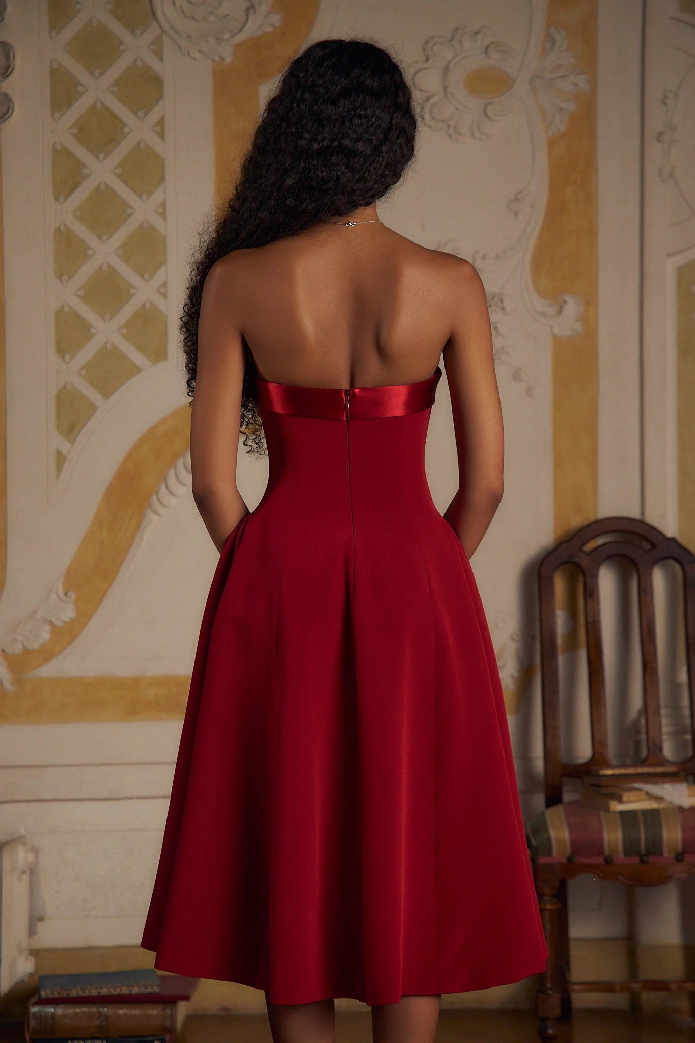 Indulge in luxury with the Scarlet Charmeuse Dress. This strapless, lady length dress boasts a fold over collar in silk charmeuse and a built-in inner bodice with silicone gripper elastic. Equipped with godets at the high hip and invisible zipper, it offers both style and convenience. Feel chic and confident with this elegant dress.