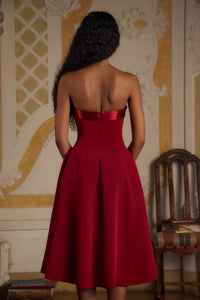 Indulge in luxury with the Scarlet Charmeuse Dress. This strapless, lady length dress boasts a fold over collar in silk charmeuse and a built-in inner bodice with silicone gripper elastic. Equipped with godets at the high hip and invisible zipper, it offers both style and convenience. Feel chic and confident with this elegant dress.