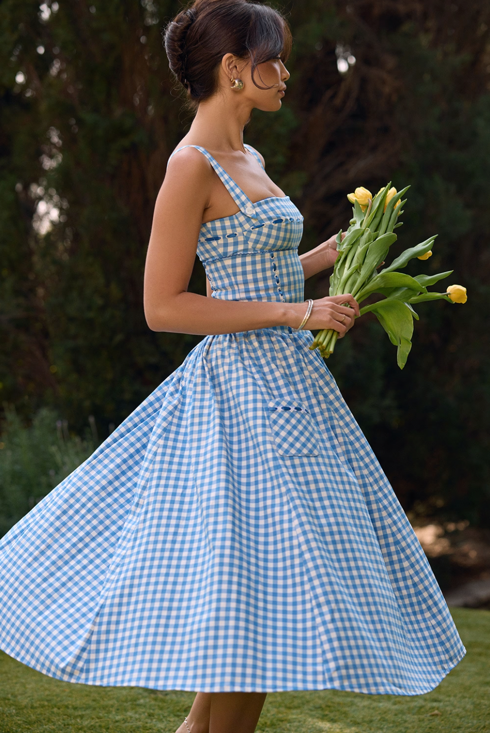 Expertly crafted from luxurious airy viscose, the Vivien Midi Dress is the must-have dress of the season. The pretty gingham pattern and delicate contrast ribbon detailing add a feminine touch, while the fitted bodice and pockets provide comfort and style. Dress it up for any occasion.