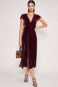 Elevate your evening look with the Clarice Velvet Midi Dress. Crafted from a lavish blend of silk and velvet, this dress exudes opulence and sophistication. Its soft texture and elegant silhouette make it the perfect choice for any party or special occasion. Turn heads and feel like a true VIP in this luxurious dress.